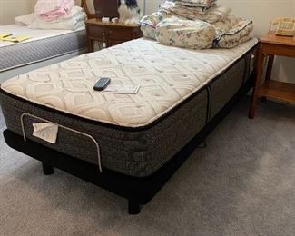 2017 bed with raising and lowering bed frame, $1750 new, perfect and clean, with remote and original purchase order