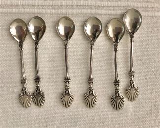 $75 Set of 6 sterling silver salt spoons with shell motif. 
