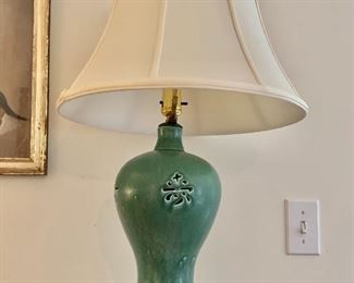 $190  Celadon lamp with pierced characters on wood base. 27" H, base 7" diam.