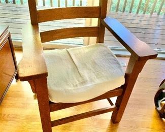 $175  Vintage oak captain's chair, 37.25" H x 28" W x 20" D x 18" seat height.