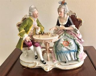 $150 Porcelain figures playing chess.   7" H, 8" W, 4" D. 