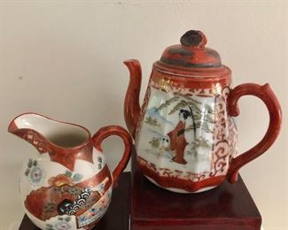 $75 Teapot and creamer.  Teapot: 5.5" H, 5" W.  Creamer:  4.25" H, 4" W.  