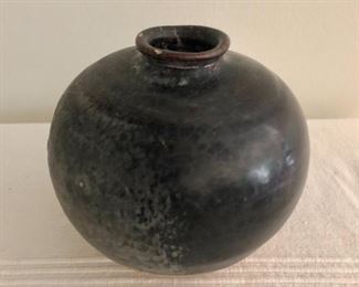$160   Circular pottery stoneware buried vessel.  4" H, 4" diam. 