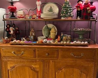 Oak serving cabinet with iron scroll work.  Spode Christmas Tree dinner and bread plates.  Lenox Winter Greetings dinner plates and footed server.  Vintage W. Germany glass ornaments.  Vintage mica composition bird candy container.