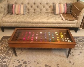 Sofa ------Unique glass top coffee table with barbie doll pieces---
