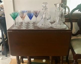 Drop leaf table, lots of glassware 