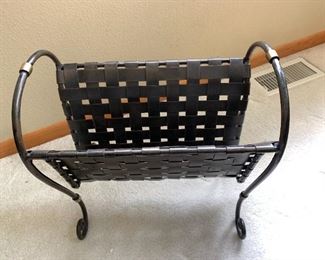 Heavy cast iron magazine rack.