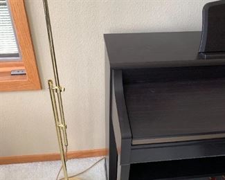 Adjustable floor lamp for reading or playing music.