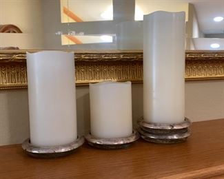 Electric candles in silver holders.