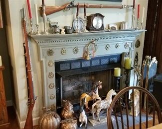 One of two replica Flintlocks,  Horse Brasses,  brass fire tools and screen. Small stove style electric heater, horse decor, PUMPKINS