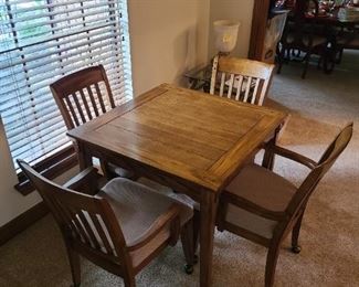 Square wood slat table with 4 rolling chairs and a SURPRISE!!!