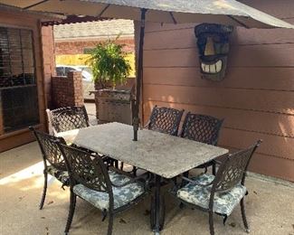 Stone top patio table w/6 chairs & umbrella