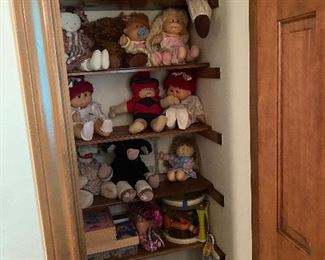 Closet full of stuffed animals of all brands Cabbage Patch dolls, puppets and games