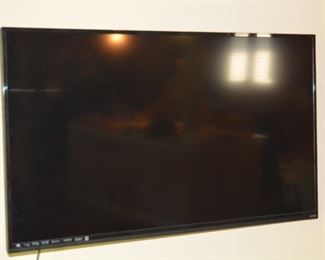 Three flat screen TVs