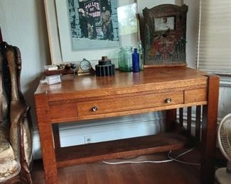 Arts and crafts desk, antique bottles, wood cog, antique Wizard  fortune teller penny slot machine by Mills Novelty company, framed art by listed artist 