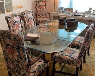Glass top dining table and set of mahogany chairs