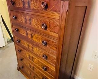 #16 - $650 • 19thcentury American transitional mahogany and burlwood 7-drawer locking tall privacy chest • locking mechanism • unusual back carving