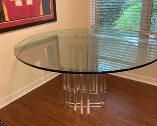 $650 •  Sculptural Lucite base round 52” table with ¾” glass top  • 60"D x 30"H - glass 3/4" thick