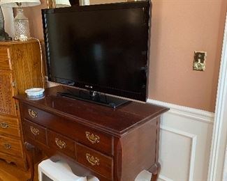 Soiling mahogany Queen Anne style cabinet and tv