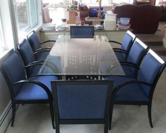 Stunning glasstop dining table and 8 arm chairs 