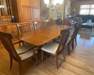 Kincaid dining set with 8 chairs and 2 removable leafs. Measures 75"x42"x30" and each leaf adds 20".
