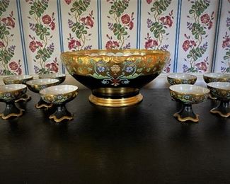 Hand painted porcelain punch bowl with ten matching footed punch cups.  