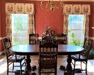 A vintage French Country stile dining table and matching chairs