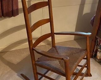 Antique ladder back rocking chair with rush seat
