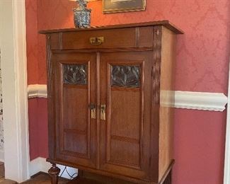 Antique walnut cabinet from Germany with beveled glass lights in the door panels 
