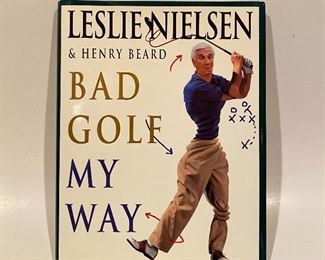 Book by actor Leslie Nielsen & Henry Beard,  ‘Bad Golf, My Way’.   It is hand autographed by Leslie Nielsen, who was one of the funniest comedic actors of the late 20th century. 