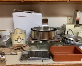 Bread machine, juicer, grater, pyrex, meat and cheese slicer, bread pans, cheesecake pans, pie dishes, cake pans