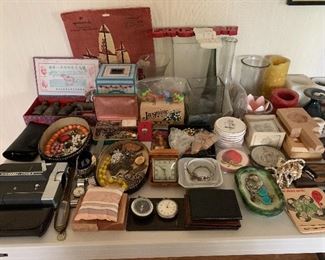 Assorted nicknacks,, watches, jewelry, coasters, vintage movie camera 