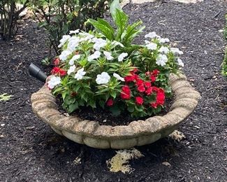 Many potted florals in stone pots
