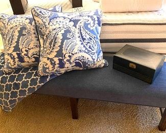 Denim bench with large upholstered pillows in blue and white