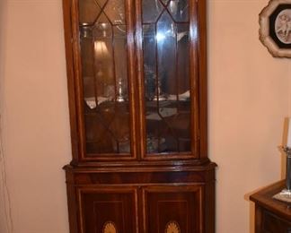 Gorgeous Corner China Cabinet ( one of 2 matching ) accented with Wave like Fennials and Sheraton inlaid wood.