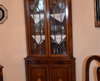 Gorgeous Corner China Cabinet ( one of 2 matching ) accented with Wave like Fennials and Sheraton inlaid wood.