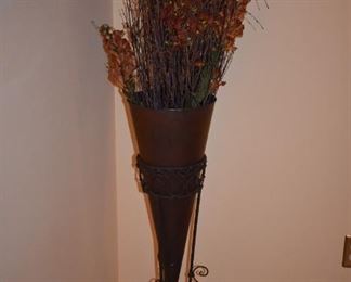 Filled with Greenery is this Cone Shaped Metal Cone with Iron Filigree Floor Stand