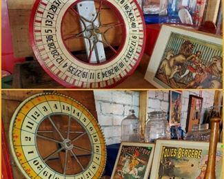 Vintage carnival wheels & crates, circus signs, and wooden juggling pin. 