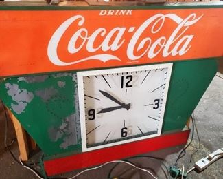 Coca Cola sign and clock.