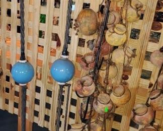 Blue milk glass & braided copper lightening rods, Mexican pottery herb pots. 