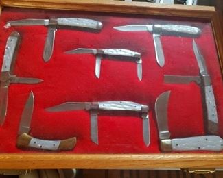 Red Deer framed unused pocketknife collection. 