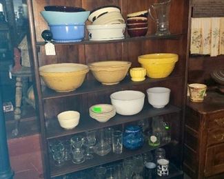 Antique open front cabinet, pottery bowls, glasses, etc. 
