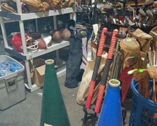 Vintage sporting equipment including megaphones hand painted Dartmouth, Yale; gloves, golf clubs, pogo sticks, and more. 