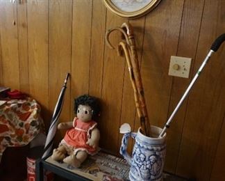 bench, canes, dolls, umbrella