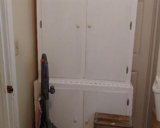 Wooden Double Door Storage Cabinet or Pantry. Could be used in Kitchen, Laundry Room, Bathroom, Shop. This Wooden Cabinet is made in Two Sections. Te Top Cabinet with Two Doors sits on top of the Bottom Two Door Wider Base. Bolts/Easily take top off for moving if necessary. 