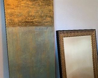 art work and gold gilded mirror