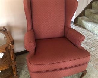 Matching pair of burgundy colored arm chairs