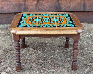 Small wooden table with Mexican tile top