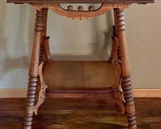 Parlor table on wood wheels