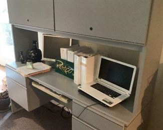 Basement filled with office furniture
desks, file cabinets, much more